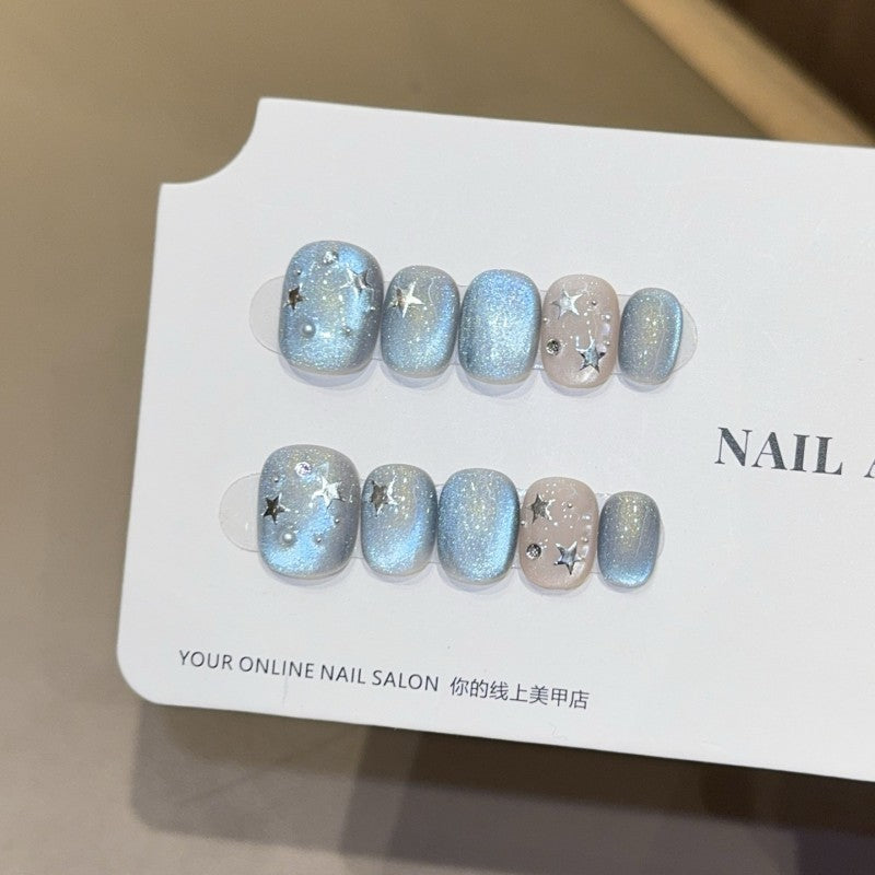 Ditto sweet-and-edgy blue starry short oval press-on nails reusable design